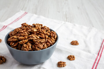 Raw Organic Walnuts in a Bowl, side view. Copy space.