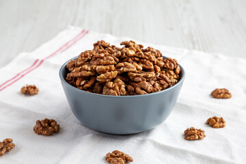 Raw Organic Walnuts in a Bowl, side view.