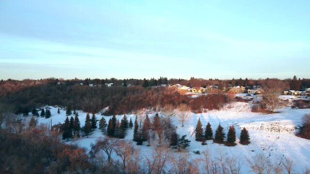 Aerial of a snow-covered river valley in November morning in Edmonton, Alberta, Canada.