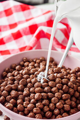 sweet crunchy chocolate children's breakfast chocolate balls on a white background