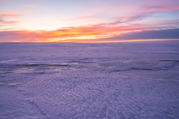 Sunset over the frozen sea. Pörkenäs, Finland.