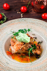 Fried chicken pieces with sweet peppers, onions, herbs and cream sauce.