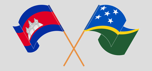 Crossed and waving flags of Cambodia and Solomon Islands