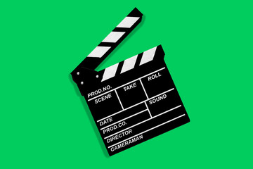 Fototapeta na wymiar Clapperboard for shooting video footage takes on a green background