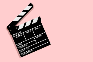 Fototapeta na wymiar Movie clapperboard for shooting videos and movies on a powdery background copy space