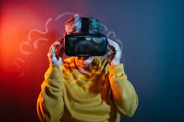 Female pensioner exploring virtual reality