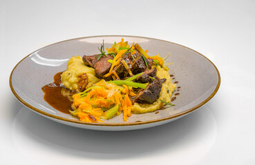 braised beef cheeks with truffle polenta and vegetable strips