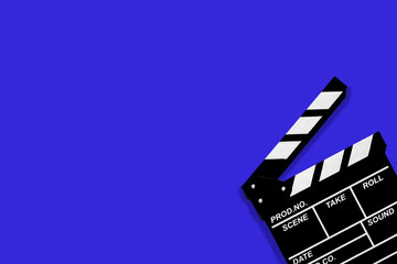Movie clapperboard for shooting videos and movies on a blue background plenty of space for text