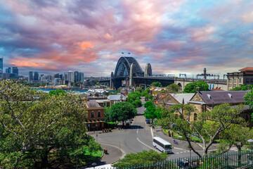 Sydney Harbour viewed from Observatory Park and overlooking Sydney Rocks area and North Sydney with colourful skies NSW Australia - obrazy, fototapety, plakaty