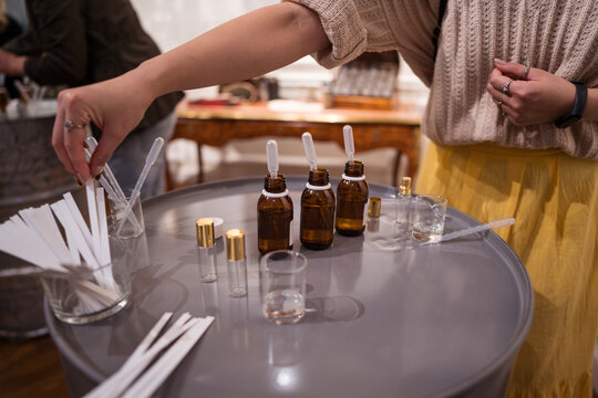 Crop master preparing perfume on table