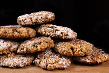 Pyramid of oatmeal cookies on a black background
