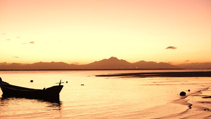 boats at sea under the sunset