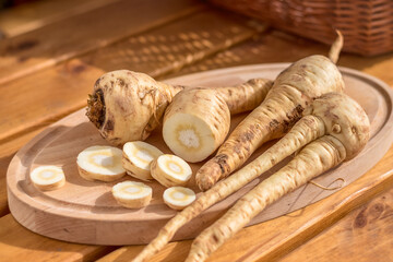 parsnip - sliced parsnip root on a cutting board