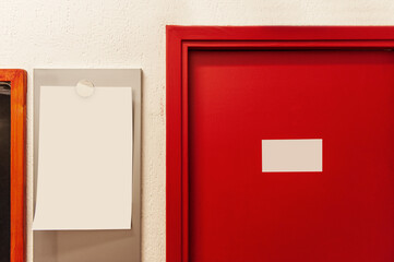 red door with blank sign