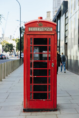 Old red telephone box in London, England