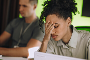 Modern office employee suffering from work-related stress