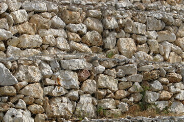 High wall made of stone and concrete.