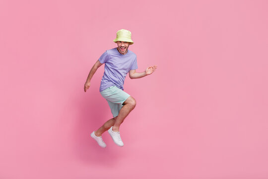 Full length photo of nice boy dressed stylish outfit escape home duties dream rest relax sea vacation isolated on pink color background