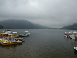 Fototapeta premium Gerardmer - August 2020 : Visit of the city of Gerardmer - Tour of the beautiful lake in the middle of the Vosges mountains with an August sunset 