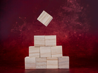 blank wooden blocks ready for graphics on a dark red background