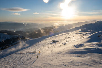 sunset above ski slope in Slovakia tatra mountains © phpetrunina14