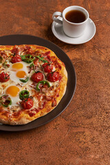 breakfast pizza with eggs and coffee