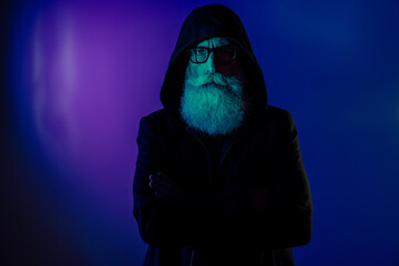 Photo of mysterious dangerous man dressed black pullover hood spectacles hands crossed folded isolated dark blue color background - obrazy, fototapety, plakaty