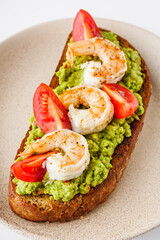 delicious Italian bruschetta with shrimps on a white background