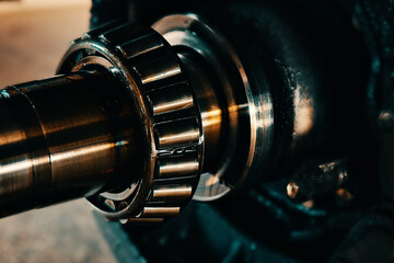 Fototapeta na wymiar Lubricated roller bearing. Truck suspension repair part. Close-up. Background.