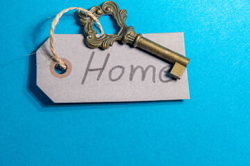 key with label home on blue