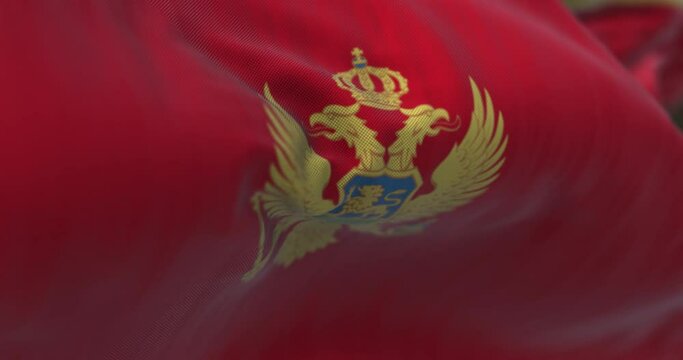 Close up view of the Montenegro national flag waving in the wind