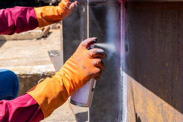 Use Developer Sprays into the welded to pull the liquid penetrant from the defect for...