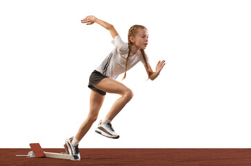 Young athlete, beginner female track runner bursting off starting block isolated over white...