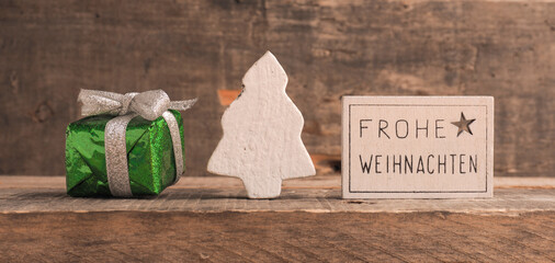 Frohe Weihnachten on a small sign, German Merry Christmas