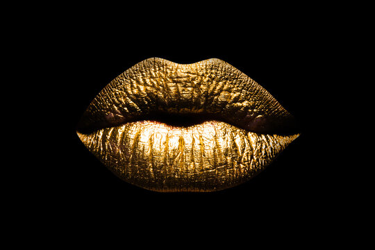 Golden lips isolated on black background. Clipping path gild lips. Luxury glamour art mouth.