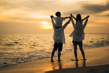 Silhouette of family with beach therapy, Happy family spending time together at beach, Parents give...