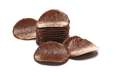 Pile of cripsy dark chocolate wave chips isolated on white