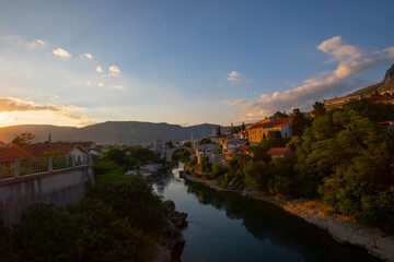 A beautiful view of the old bridge across the Neretva River in Mostar, Bosnia and Herzegovina, on a...