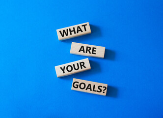 Goals symbol. Concept words What are your goals on wooden blocks. Beautiful blue background. Business and What are your goals concept. Copy space.