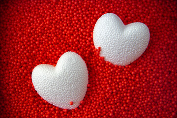 Fototapeta premium red hearts on a red background