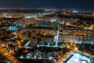 Fototapeta na wymiar Warsaw by night, aerial landscape of illuminated streets and buildings