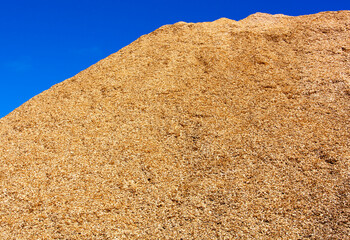 The Woodpile of Sawdust And A Blue Sky