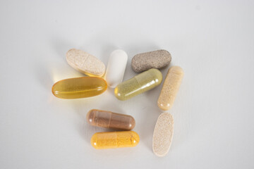 Pills vitamins on white background top view 