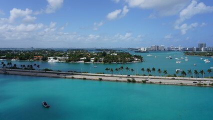 Aerial view of waterfront residential and office buildings Biscayne Bay on sunny cloudless morning in Miami, Florida.