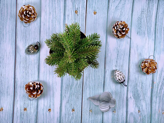 Christmas background on the wooden desk. CHRISTMAS accessories wallpaper. Festive holiday Christmas backdrop. Flat lay with Christmas tree decorations. Winter, new year concept.