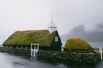 church with green roof in the faroe islands