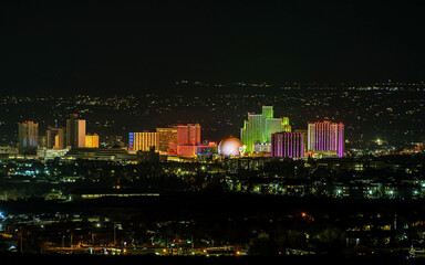 Fototapeta premium City of Reno Nevada skyline at night with Hotels, casinos and the surrounding urban area