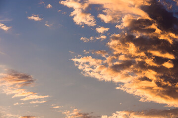 Scattered clouds in morning or evening light. Dramatic sky or calm cloudscape formation