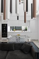 Interior of modern apartment - living room connected with white kitchen