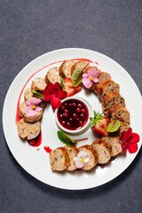 Serving meatloaf with cranberry sauce in a restaurant.